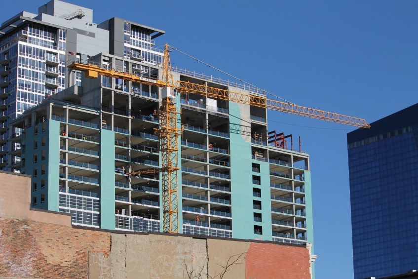 Triple-branded Hilton tower crane removal
