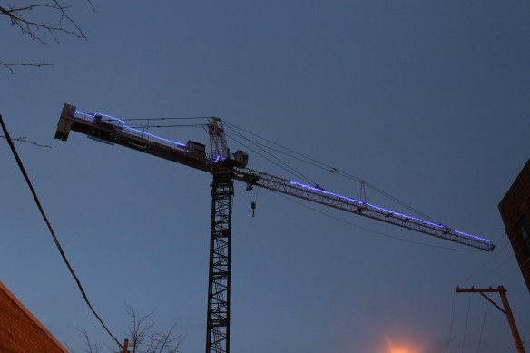 Twelve01West glowing tower crane